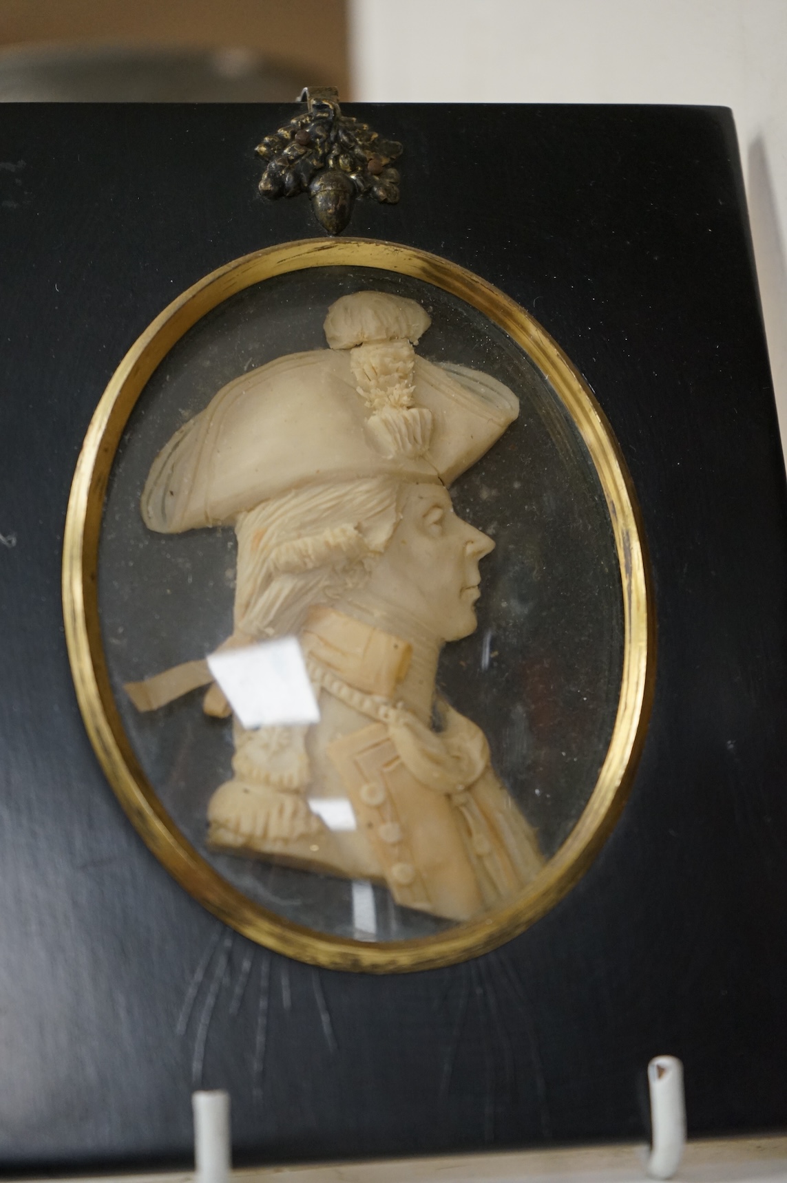 A pair of wax portrait busts by Leslie Ray depicting a Naval Officer and a lady, 16cm high